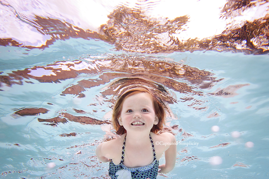 photographs taken underwater of child